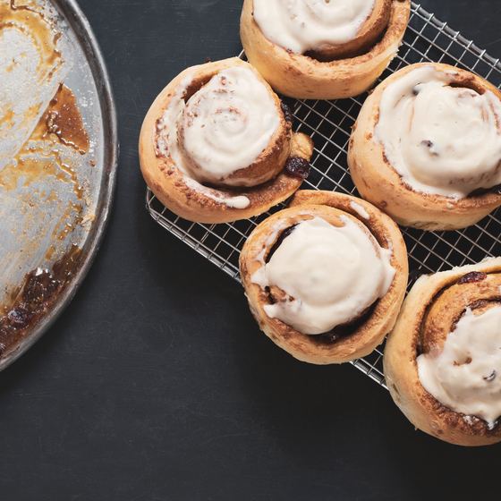 Iced buns cooling on a wire rack