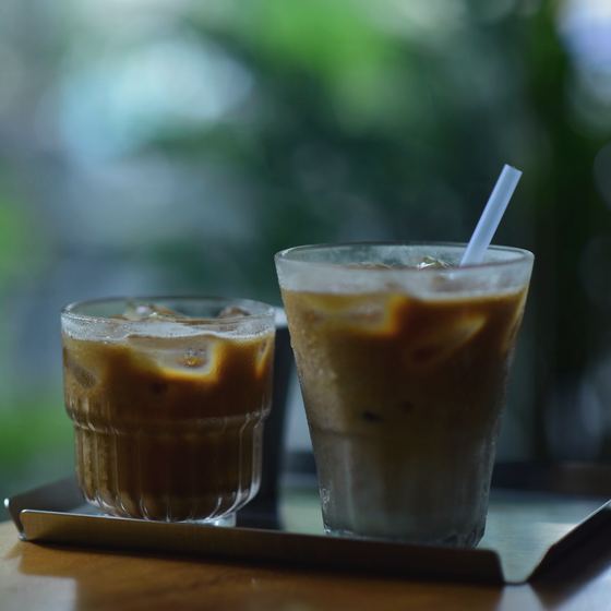 Two iced coffees on a tray
