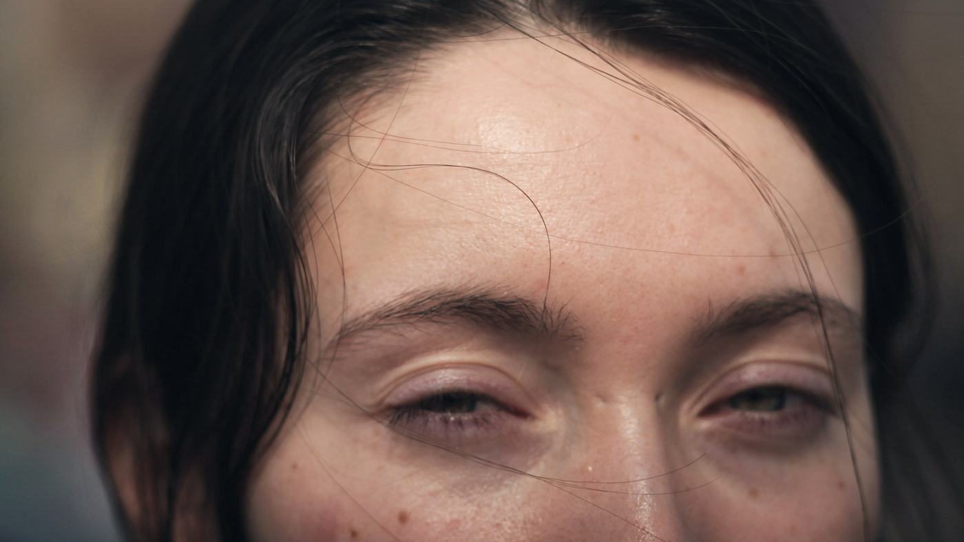 Close-up of a woman’s brow and closed, relaxed eyes