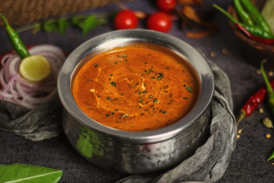 Dal makhani in a steel handi, finished with cream