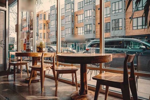 A sunny cafe window looking out on a Brixton street