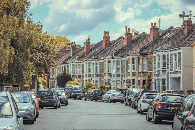 A long row of Victorian terraces with chimney stacks in Tulse Hill
