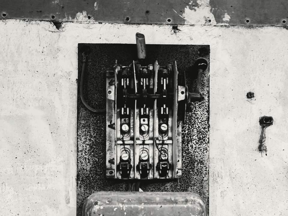 Before: an old fuse board with rewireable fuses