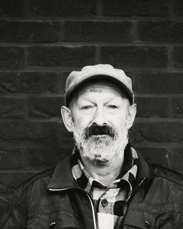 Ray Kestle, founder, in a cap and work jacket